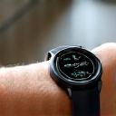 Smartwatch displaying stress levels and relaxation suggestions, on a user's wrist.